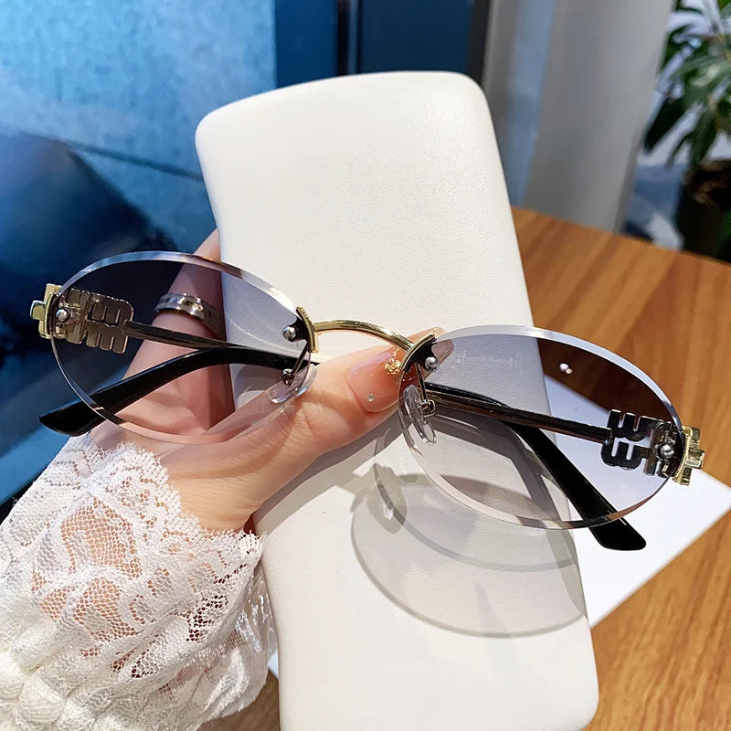 Oval Frame Sunglasses New Rimless Cut Edge Personality Glasses Fashion Design Sense Small Frame Sunglasses 90289