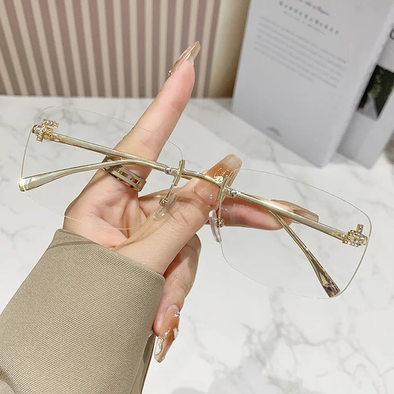 Ruiao rimless sunglasses UV400 fashion square metal glasses for women luxury brand designer diamond y2k small face sun glasses